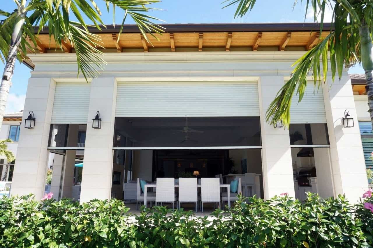 Luxury motorized screen creating a protected outdoor living room