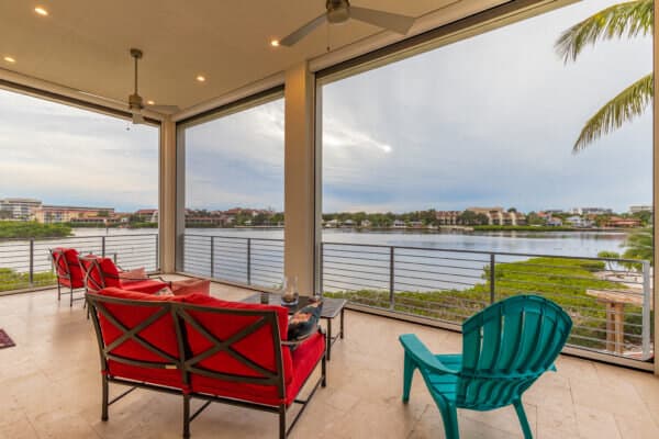 Outdoor screens installed around a waterfront covered patio